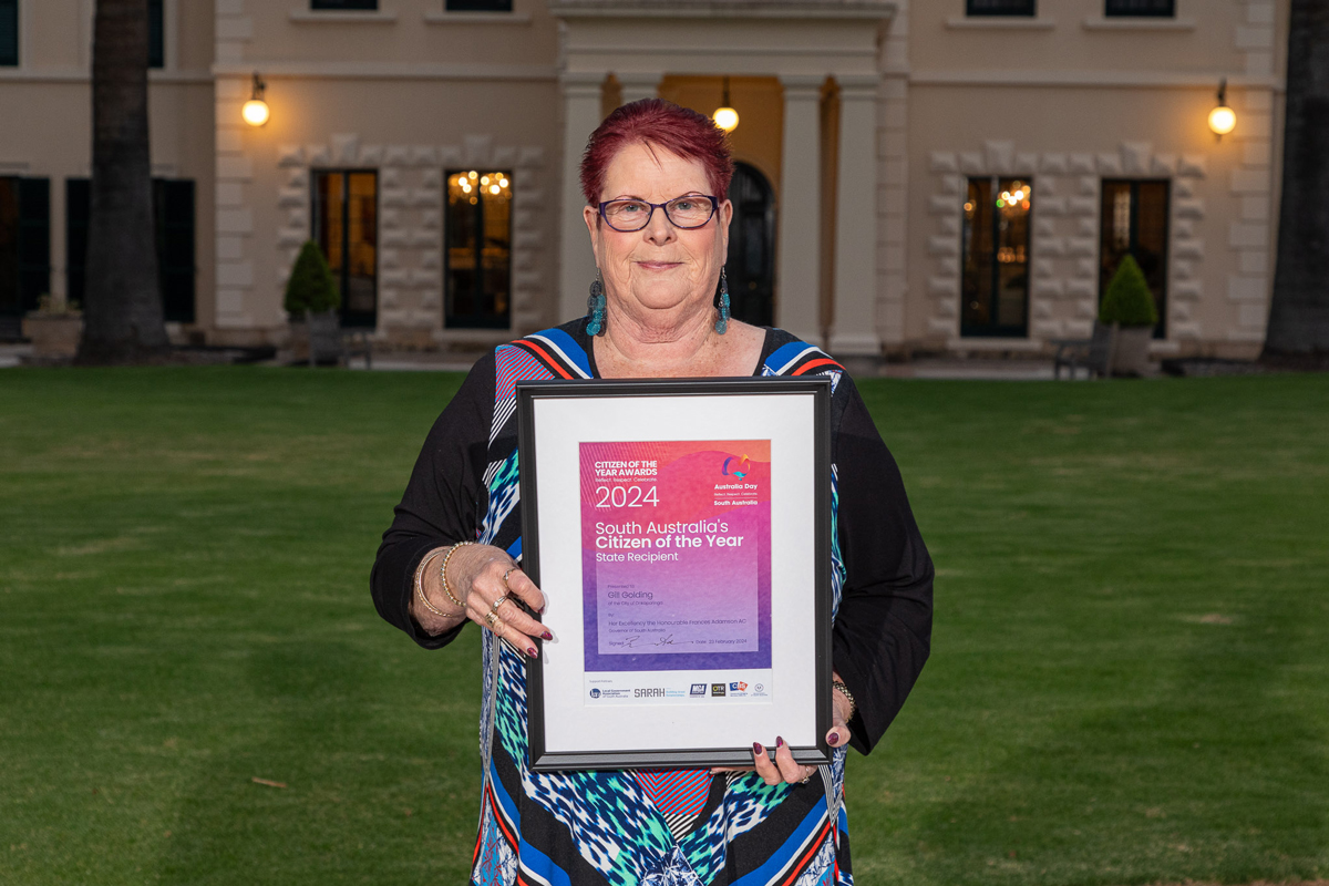 Image of Gill Golding holding Citizen of the Year certificate