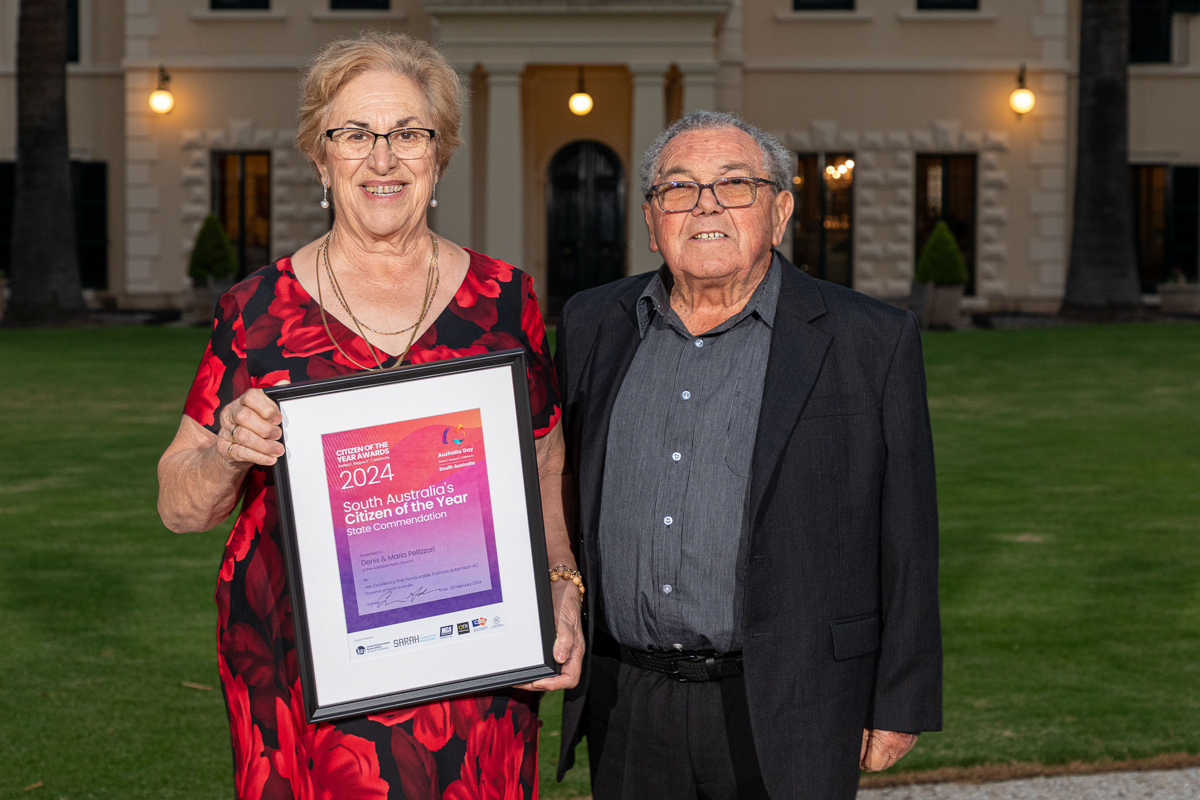 Image of Maria and Dennis Pellizzari holding Citizen of the Year commendation certificate