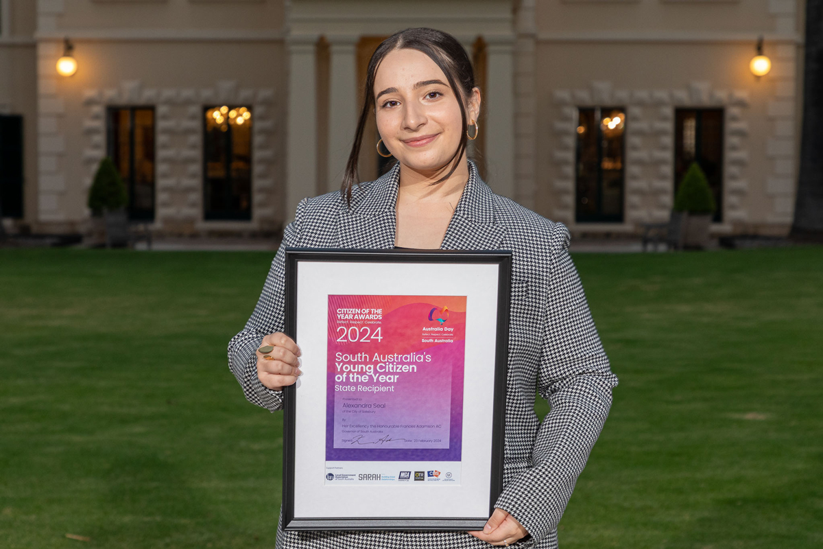 Image of Alexandra Seal holding young Citizen of the Year certificate