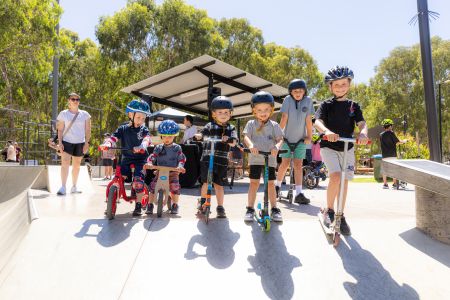 Opening of the Campbelltown Skatepark, image shows a large group of young boys on scooters at the new skatepark