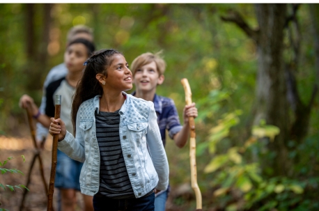 Kids walking through forest